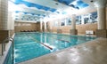 Indoor public swimming pool interior in fitness gym club Royalty Free Stock Photo