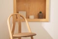 Indoor room studio minimalist property with wooden furniture. Modern simple interiors with wooden chair