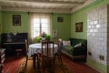 Old wooden house interior with antique furniture and ceramic stove, Rumsiskes, Lithuania