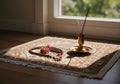 Religious objects on prayer mat Royalty Free Stock Photo
