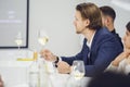 Good looking caucasian ethnicity man tasting white wine from glass being trained as sommelier at school of bartenders Royalty Free Stock Photo