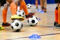 Indoor Soccer Class for Kids at School Sports Hall. Children Kicking Soccer Balls on Wooden Futsal Floor. Royalty Free Stock Photo