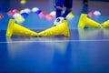 Indoor soccer player on training during the winter. Futsal training field with blue cones Royalty Free Stock Photo