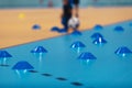 Indoor soccer training during the winter. Futsal training field with blue cones