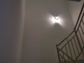 Indoor staircase light bulb at night