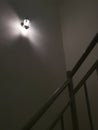 Indoor staircase light bulb at night