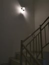 Indoor staircase light bulb at night