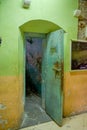 Indoor view of old deserted rugged rusted building entrance for the room of prisioners, in the old prison Penal Garcia Royalty Free Stock Photo