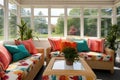 indoor view of sunroom with patterned cushions