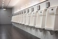 Indoor white urinals men public toilet Royalty Free Stock Photo