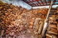 Indoor woodshed with nicely arranged chopped firewood