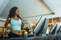 Indoors fitness center lifestyle  portrait of young attractive and sweaty black African American woman training hard at gym doing Royalty Free Stock Photo