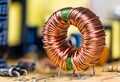 Induction coil with copper wire winding soldered on printed circuit board