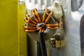 An inductor, toroidal coil on a ring with visible copper scroll, wound on a magnetic coil. Royalty Free Stock Photo