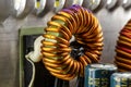 An inductor, toroidal coil on a ring with visible copper scroll, wound on a magnetic coil. Royalty Free Stock Photo