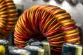 An inductor, toroidal coil on a ring with visible copper scroll, wound on a magnetic coil. Royalty Free Stock Photo