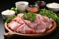 Raw chicken meat on wooden plate with spices and vegetables on black background Ai generative