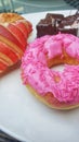 a white plate topped with donuts and pastries