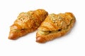 Two pistachio cream croissants on white background