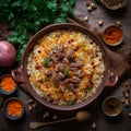 Colorful and fragrant bowl of Tajikistan& x27;s signature rice pilaf, Osh, with tender pieces of lamb or beef