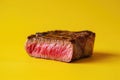 Indulge in the irresistible appeal of a succulent piece of steak showcased against a striking yellow backdrop, A colorful