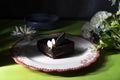 Plate with slice of tasty homemade chocolate cake on table Royalty Free Stock Photo