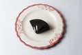 Plate with slice of tasty homemade chocolate cake on table Royalty Free Stock Photo