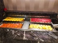 Fruit section in the breakfast buffet, pineapple, guava, watermelon, orange.