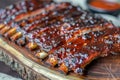 succulent grilled pork ribs on rustic wooden plate, Generative AI Royalty Free Stock Photo