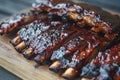 succulent grilled pork ribs on rustic wooden plate, Generative AI Royalty Free Stock Photo