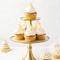 Golden Cupcakes with Luscious Creams and Frostings - Generative AI