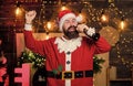 Indulge yourself in joy. Celebration time. Man bearded santa celebrate christmas at home. Winter carnival. Santa claus Royalty Free Stock Photo