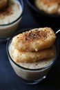 Indulgent creamy pudding with spiced biscuit garnish Royalty Free Stock Photo