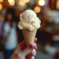 Indulgent delight Hand holds vanilla ice cream in a delicious dessert