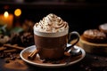 A cup of hot chocolate luxuriously topped with whipped cream.