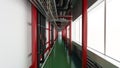 Industiral white wall and red structure long corridor in daylight Royalty Free Stock Photo