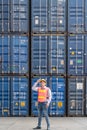 Industrail background of asian containers yard and cargo inspector working at containers loading area