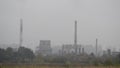 Industrial air pollution from smokestacks. Factory chimney blowing pollution in environment. Toxic smoke from chimney in industria