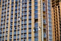 Industrial alpinists work at residential building under construction Royalty Free Stock Photo