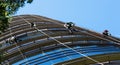 Industrial alpinists cleaning skyscraper