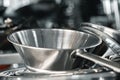 Industrial aluminum colanders on professional kitchen close up