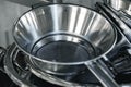 Industrial aluminum colanders on professional kitchen close up