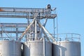 Industrial architecture silo, large tanks made of concrete for storage bulk materials under blue sky Royalty Free Stock Photo