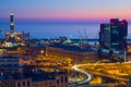 Industrial area near the port with Lanterna and commercial skyscrapers at sunset, Genoa, Italy Royalty Free Stock Photo