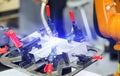 Industrial auto robot welding steel construction by cnc program Royalty Free Stock Photo