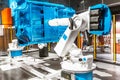 automated robotic arm working in car factory