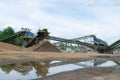 Industrial background - crusher rock stone crushing machine at open pit mining and processing plant for crushed stone, sand and Royalty Free Stock Photo