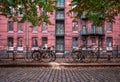 Empty urban street with warehouse brick wall in the back