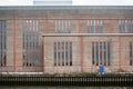 Industrial background featuring detail of factory or warehouse waterfront brick faÃÂ§ade Royalty Free Stock Photo