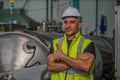 Food factory engineer with steam retort in factory food processing room